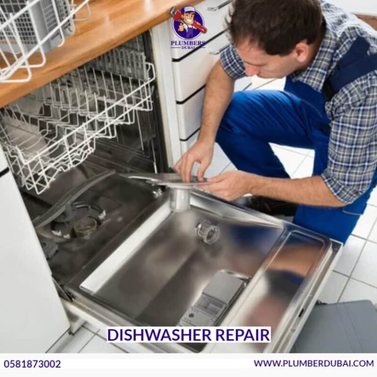 Technician repairing dishwasher in Abu Dhabi home kitchen